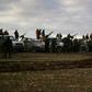 Turkish-backed Syrian fighters gather with their vehicles at a position near the northern Syrian town of Manbij, though the US military says it has seen no indication of the Syrian army entering the city