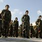 Fighters of the Kurdish-led Syrian Democratic Forces parade at the funeral on November 11, 2018 of a comrade killed in the US-backed campaign against the Islamic State group that President Donald Trump now says is over