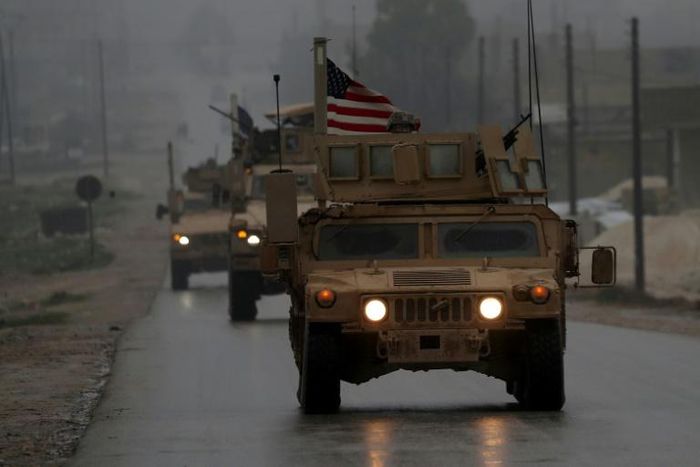 US military vehicles in the northern Syrian city of Manbij, which has long been held by the Kurdish-led Syrian Democratic Forces but is the target of a planned offensive by pro-Turkish forces
