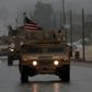 US military vehicles in the northern Syrian city of Manbij, which has long been held by the Kurdish-led Syrian Democratic Forces but is the target of a planned offensive by pro-Turkish forces