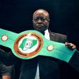 Boxing promoter Raufu Ladipo displays a lightweight belt to be contested by boxers during a GOtv title fight at the National Stadium in Lagos on April 15, 2018