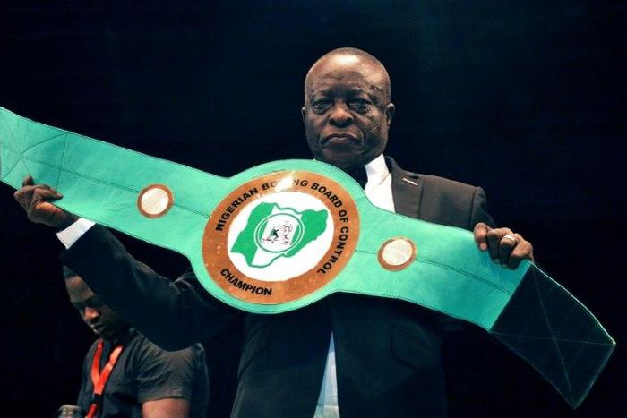 Boxing promoter Raufu Ladipo displays a lightweight belt to be contested by boxers during a GOtv title fight at the National Stadium in Lagos on April 15, 2018