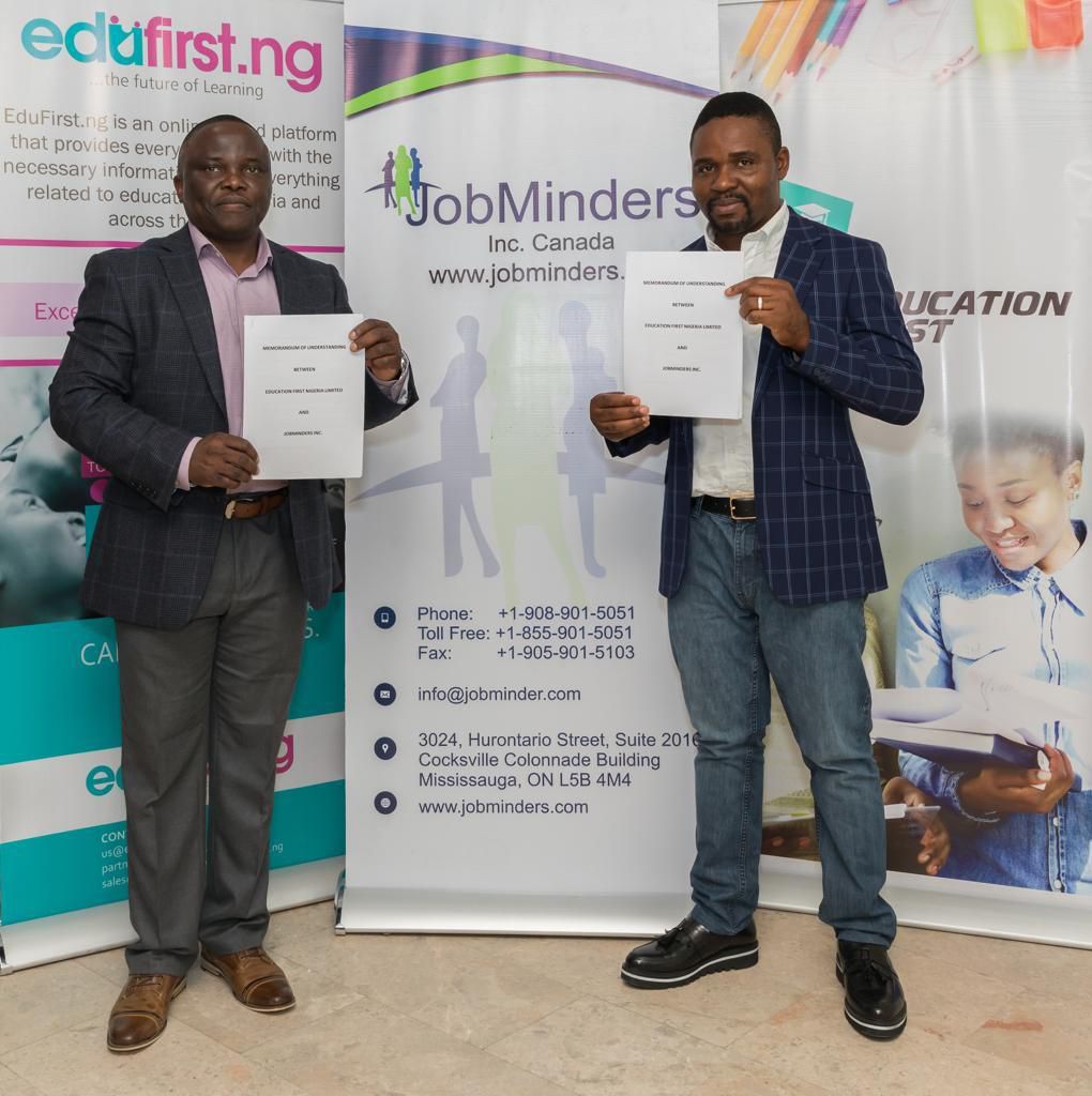 L-r: Vice President, Business Development at JobMinders, Charles Osazuwa, and Co-Founder and CEO, EduFirst.ng, displaying the agreement signed on Thursday at Skool Media office in Lagos