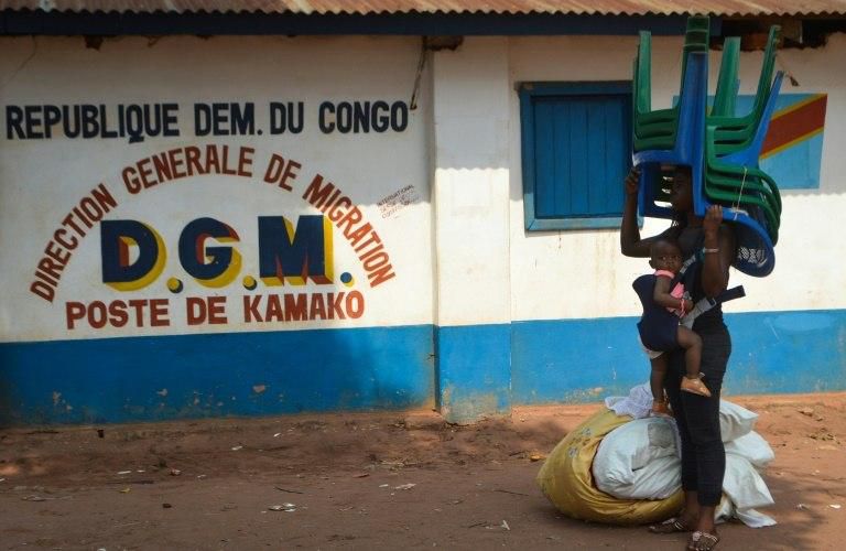 Humanitarian crisis group ACAPS asys that although the Angolan government "claims all returns are voluntary, there have been reports of forced returns," and migrants (like the woman pictured October 12, 2018) arrive with "almost nothing"