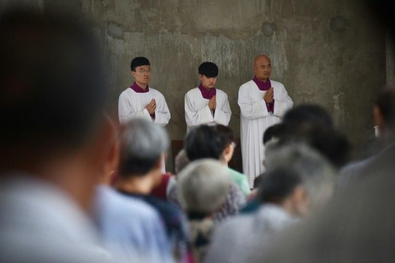 Clergy take part in a mass at the Sacred Heart of Jesus Catholic Cathedral in Anyang in China's central Henan province