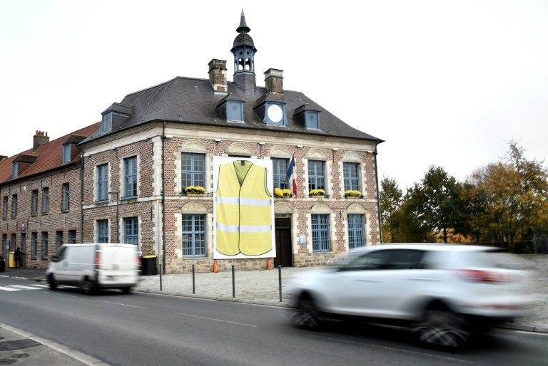 The mayor in one town Morbecque, northern France, had a giant poster of a yellow vest displayed on its facade as a sign of support for protests against the rise of fuel prices