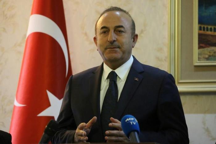Turkish Foreign Minister Mevlut Cavusoglu speaks during a press conference with his Libyan counterpart at Mitiga International Airport near the Libyan capital Tripoli, on December 22, 2018