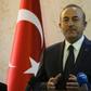 Turkish Foreign Minister Mevlut Cavusoglu speaks during a press conference with his Libyan counterpart at Mitiga International Airport near the Libyan capital Tripoli, on December 22, 2018