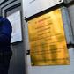 A policeman stands guard at the entrance of the Jewish Museum of Belgium in central Brussels after the unveiling of a plaque in memory of the four people shot dead there by a suspected jihadi extremist who had returned from Syria