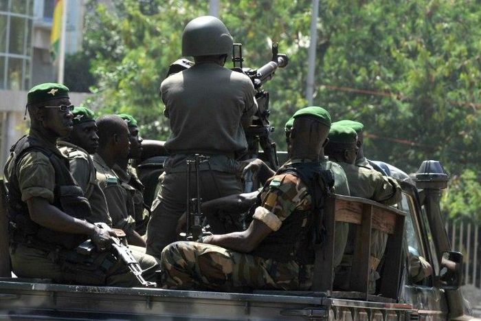 Guinean soldiers, similar to these pictured in 2010, opened fire ona group of men leaving a house in Conakry, killing two of them