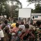 Many residents of a village of the Mbyaka (Pygmy) people gather in Bayanga after a trek for the cinema night
