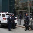 Police stand outside the Time Warner Building on October 24, 2018, after an explosive device was delivered to CNN's New York bureau