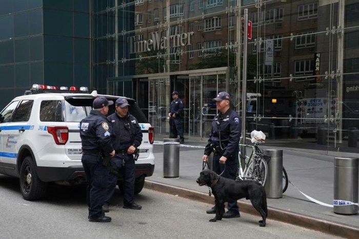Police stand outside the Time Warner Building on October 24, 2018, after an explosive device was delivered to CNN's New York bureau