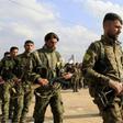 Members of the People's Protection Units (YPG) attend the funeral of fellow Kurdish fighters who were killed in combat against Islamic State (IS) group in Deir Ezzor, on March 3, 2018, in Qamishli