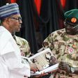 Nigerian President Muhammadu Buhari (left) meets top military in Maiduguri as part of a visit to troops on the front lines of the Boko Haram conflict which claimed another three soldiers' lives earlier this week.