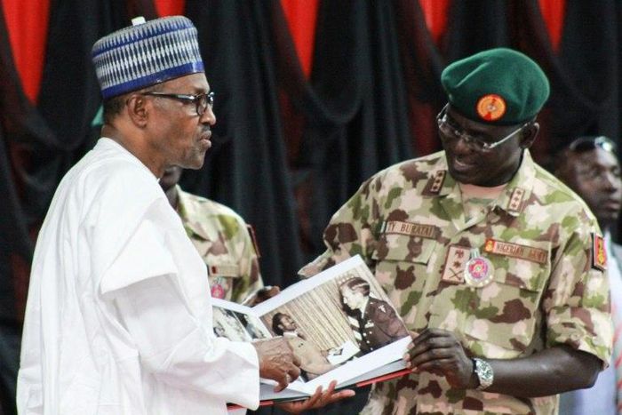 Nigerian President Muhammadu Buhari (left) meets top military in Maiduguri as part of a visit to troops on the front lines of the Boko Haram conflict which claimed another three soldiers' lives earlier this week.