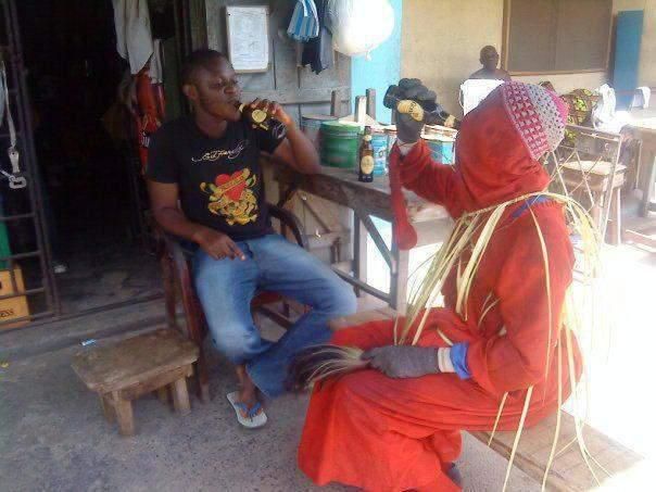 Masquerade drinking beer [Nairaland]