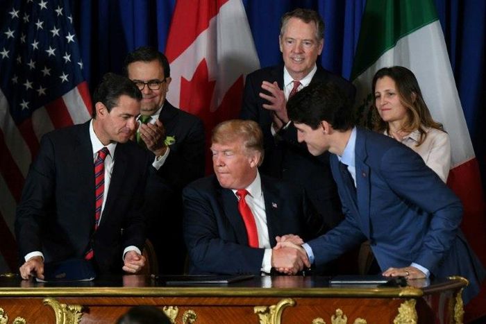 Mexican President Enrique Pena Nieto (L), US President Donald Trump (C) and Canadian Prime Minister Justin Trudeau are pictured after signing a new free trade agreement in Buenos Aires, on November 30, 2018, on the sidelines of the G20 Leaders' Summit