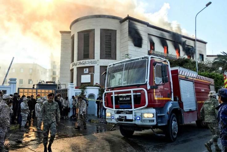 A fire truck and security officers outside Libya's foreign ministry in the capital Tripoli on December 25, after an attack that was claimed by Islamic State