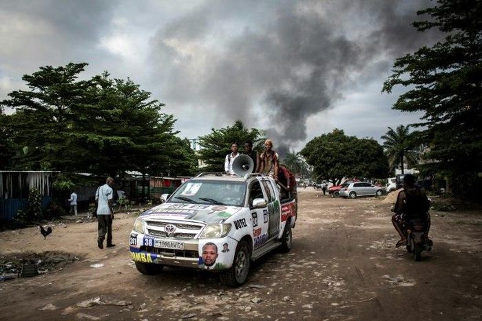 In the early hours of Thursday, arsonists hit a large electoral commission warehouse in central Kinshasa, setting it ablaze and damaging election materials