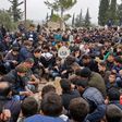 Mourners attend the funeral of citizen journalists Raed Fares and Hamod Jnaid, who were "shot dead by unknown assailants" in the village of Kafr Nabel in the northwestern province of Idlib