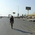 A Yemeni pro-government fighter walks in the rebel-held port city of Hodeida on December 15, 2018