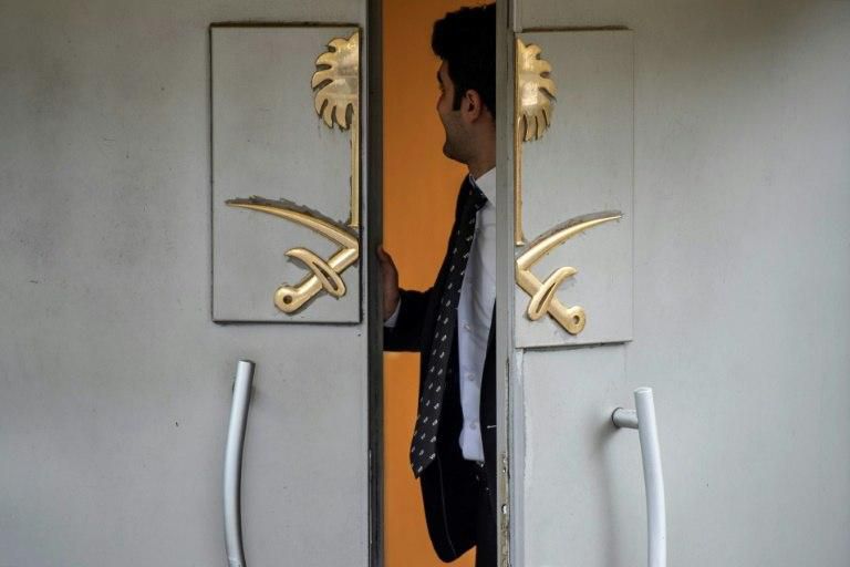 An official stands at the door of Saudi Arabia's consulate in Istanbul, on October 23, 2018, during ongoing investigations into the killing of Saudi journalist Jamal Khashoggi