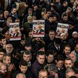 People hold banners of Jamal Khashoggi during a symbolic funeral prayer for the Saudi journalist, in Istanbul