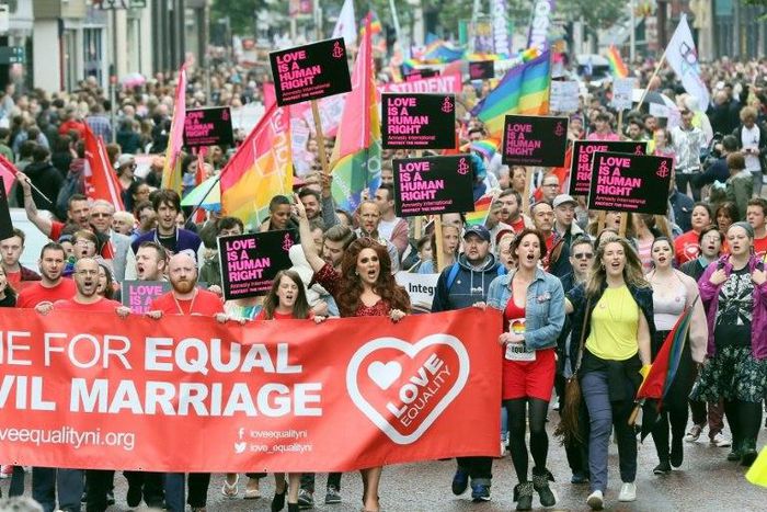 Gay rights campaigners march through Belfast July, 2017 to protest a ban on same-sex marriage
