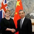Australian Foreign Minister Marise Payne (L) says she raised the Xinjiang internment camps in talks with China's top diplomat Wang Yi (R)
