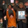 Kim Sung-joo (in orange), a victim of forced labour by Japan, cheered in reaction to the court decision