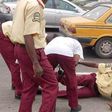 LASTMA officials offer aid to a colleague who appears to be in pain.
