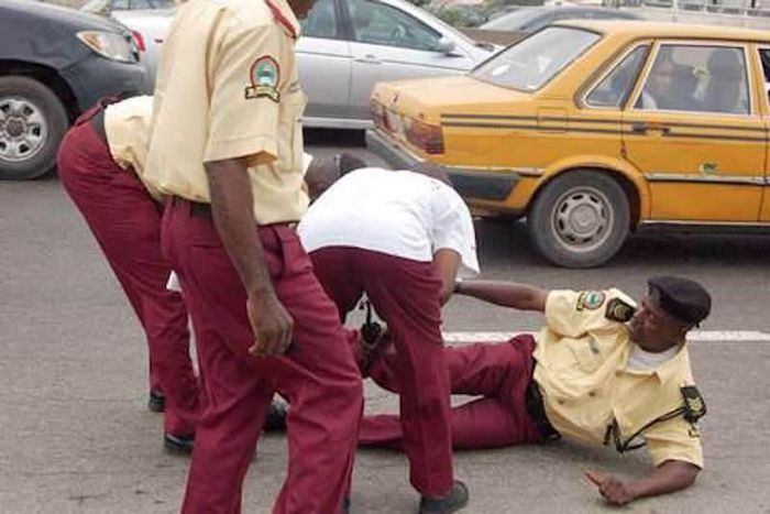 LASTMA officials offer aid to a colleague who appears to be in pain.