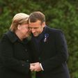 Germany is taking a softly-softly approach to French President Emmanuel Macron's easing of the budget strings to cope with protests, with Chancellor Angela Merkel (right) focussing on stability in Europe, analysts say