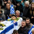 Hundreds of mourners flocked by bus and car to Bularat for the funeral, some chanting "Konstantinos, you are alive and leading us!"