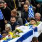 Hundreds of mourners flocked by bus and car to Bularat for the funeral, some chanting "Konstantinos, you are alive and leading us!"