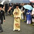 Japan's Crown Prince Naruhito (L) and Crown Princess Masako (R) greet guests during an autumn garden party at Akasaka Palace Imperial garden in Tokyo