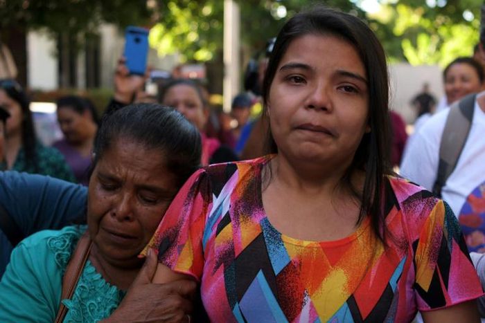 Imelda Cortez (R) was acquitted and released after being first charged with murder for giving birth prematurely in a toilet