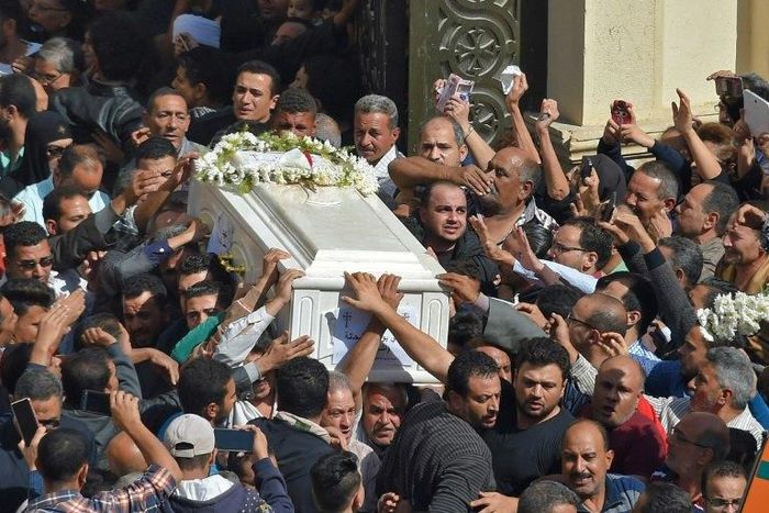 Coptic Christians carry a coffin during a funeral at the Prince Tadros church in Egypt's southern Minya province, on November 3, 2018, after a deadly gun attack on a bus carrying pilgrims