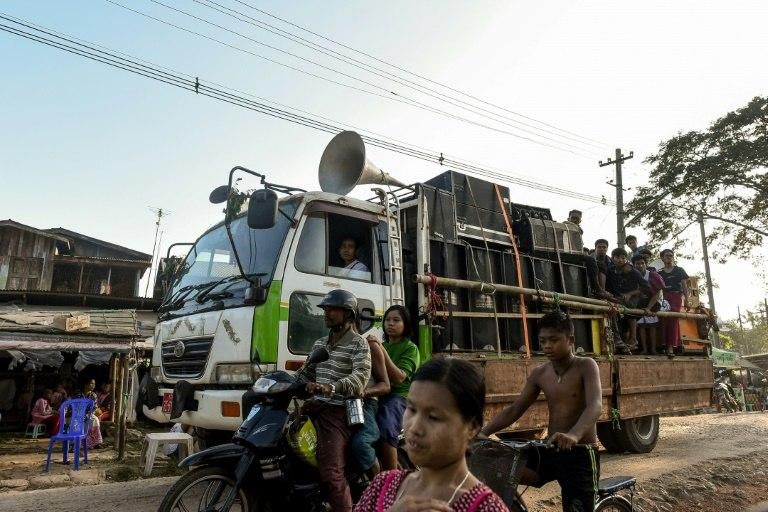 At the culmination of the religious season, Buddhist chants, sermons and entreaties for donations are blared over speakers
