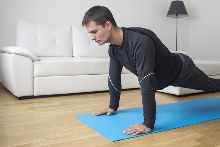 ___9158426___2018___12___2___10___man-exercising-at-home-royalty-free-image-938141486-1543440055