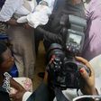 Vice President Yemi Osinbajo cradles new born baby given birth to in IDP camp
