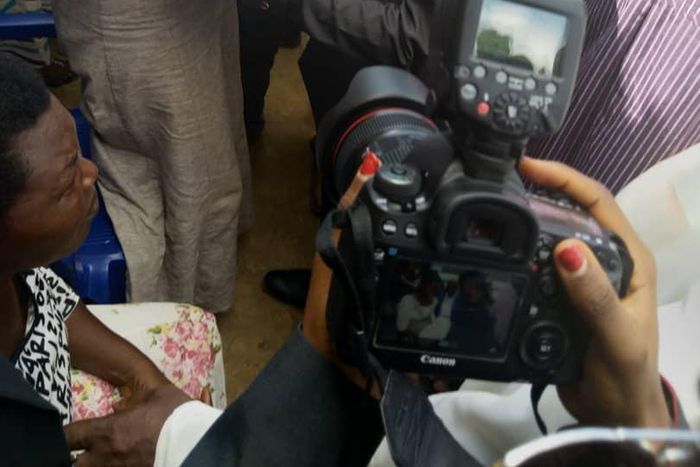 Vice President Yemi Osinbajo cradles new born baby given birth to in IDP camp