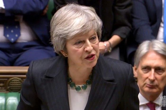Theresa May battled to defend her draft Brexit deal before a hostile parliament