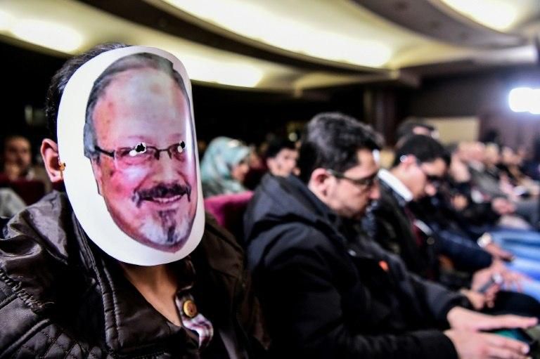 A man wears a mask of late journalist Jamal Khashoggi during a commemoration event of Khashoggi's supporters on November 11, 2018 in Istanbul