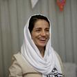 Award-winning Iranian human rights lawyer Nasrin Sotoudeh smiles at her home in Tehran on September 18, 2013, after being freed following three years in prison on state security charges