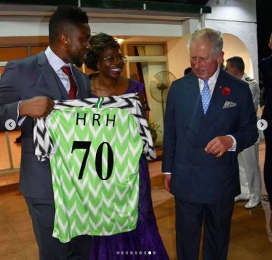 Joseph Yobo presenting a customised jersey to Prince Charles