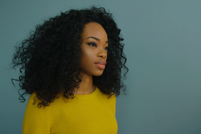 Wooman in yellow portrait [Credit : Video Blocks]