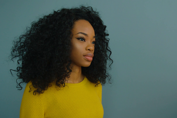 Wooman in yellow portrait [Credit : Video Blocks]