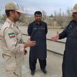 Iranian (L) and Pakistani security officials meet at Zero Point in the border town of Taftan on October 16, 2018, the day jihadists seized 12 Iranian security personnel near the border